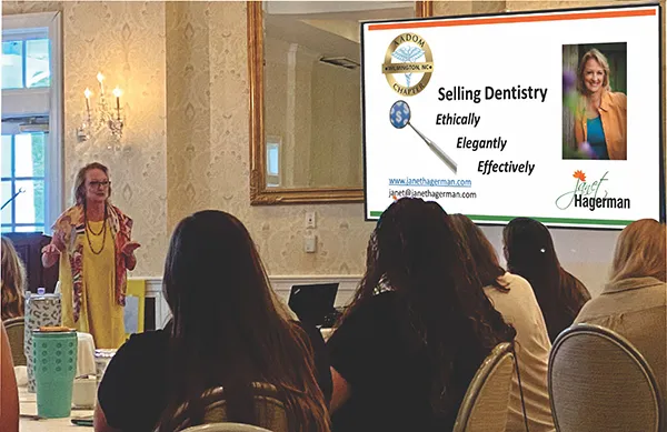 Janet giving presentation at one of the dental offices.